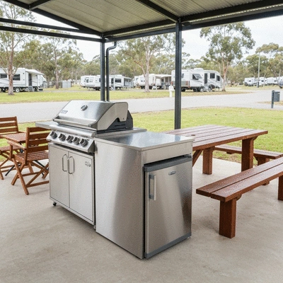 Family enjoying a BBQ at a clean modern camp kitchen facility